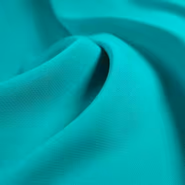 Syntetyczna tkanina gładka, krepa, soczysty grynszpan