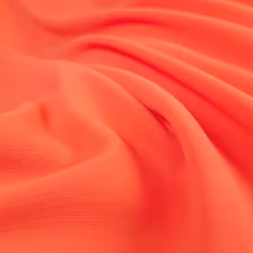 Tkanina syntetyczna gładka, krepa, intensywny koral, z wiskozą i elastanem