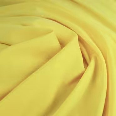 zolta dzianina cienka lejaca jednolita gladkaA