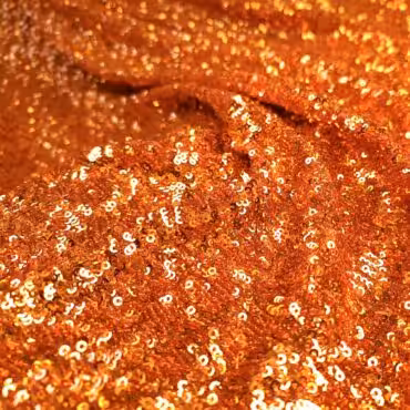 material cekinowy na tiulu pomaranczowy elastycznyA